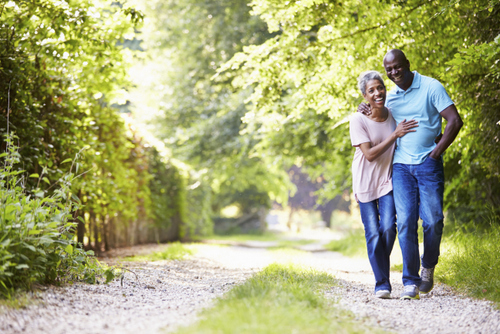 Smiling couple with single tooth replacement McNickle Family Dentistry 